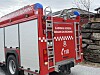 Brannbil frå Bjørnafjorden brann og redning parkert ved steinmur
